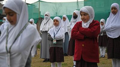 Students during the morning assembly in Srinagar, Kashmir, after returning to schools after a three-month winter vacation. (Waseem Andrabi/HT)