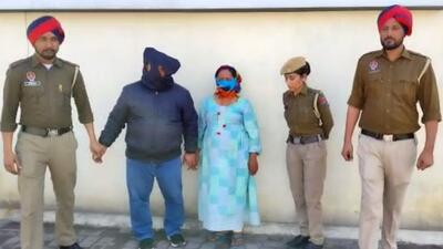 The couple in police custody on Wednesday. (HT Photo) The couple in police custody on Wednesday. (HT Photo)