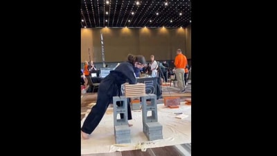 Woman breaks seven wooden planks in one go. (Instagram/@averytripp_martial_arts) Woman breaks seven wooden planks in one go. (Instagram/@averytripp_martial_arts)