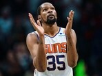 Kevin Durant #35 of the Phoenix Suns reacts in the fourth quarter during their game against the Charlotte Hornets at Spectrum Center. Kevin Durant #35 of the Phoenix Suns reacts in the fourth quarter during their game against the Charlotte Hornets at Spectrum Center.