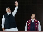 Prime Minister Narendra Modi waves at BJP workers as party President J P Nadda looks on during celebrations at the BJP HQ in New Delhi. Prime Minister Narendra Modi waves at BJP workers as party President J P Nadda looks on during celebrations at the BJP HQ in New Delhi.