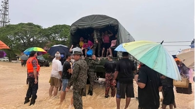 Malaysian army evacuate residents on Chaah town in Segamat, in southern Johor state, Malaysia, Wednesday. (AP) Malaysian army evacuate residents on Chaah town in Segamat, in southern Johor state, Malaysia, Wednesday. (AP)