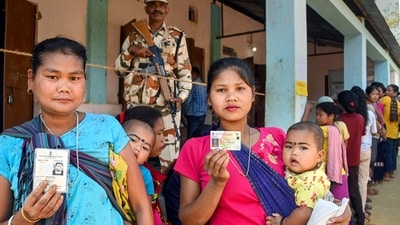 Voters show their identification cards as they wait to cast their votes at a polling booth during the Tripura Assembly elections, at Damchara in North Tripura district. (PTI) Voters show their identification cards as they wait to cast their votes at a polling booth during the Tripura Assembly elections, at Damchara in North Tripura district. (PTI)