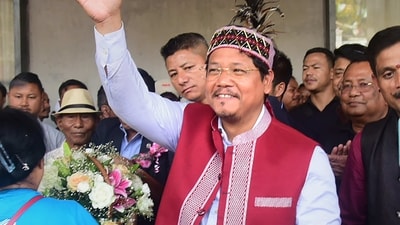 Meghalaya Chief Minister and National People's Party (NPP) chief Conrad Sangma waves at supporters gathered for celebrating his victory in Meghalaya Assembly elections from the South Tura Assembly constituency. (PTI) Meghalaya Chief Minister and National People's Party (NPP) chief Conrad Sangma waves at supporters gathered for celebrating his victory in Meghalaya Assembly elections from the South Tura Assembly constituency. (PTI)