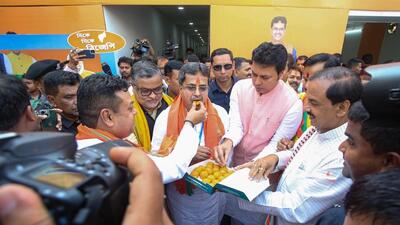 Tripura Chief Minister Manik Saha being offered sweets by BJP supporters after the party's win in the assembly elections, in Agartala on Thursday. (PTI)