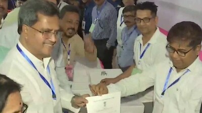 Tripura chief minister Manik Saha receives winning certificate from Election Commission officials after winning from Town Bardowali constituency. (Twitter/ANI)