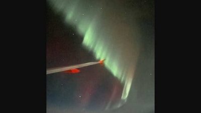 The image shows the Northern lights captured by one of the passengers on the plane. (Twitter/@APTGroves)