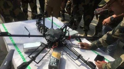 Chinese made drone launched from Pakistan with drugs and explosives consignment brought down by security forces in Jammu sector. Chinese made drone launched from Pakistan with drugs and explosives consignment brought down by security forces in Jammu sector.