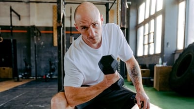 Concentration Curl: This exercise is great for targeting the inner part of your biceps. Start by sitting on a bench with a pair of dumbbells in your hands. Keeping your elbows close to your body, curl the dumbbells up until your forearms touch your biceps. Slowly lower the dumbbells back to the starting position. (Pexels )