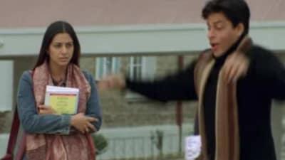 Tabu makes a face as Shah Rukh Khan dances in Main Hoon Naa.