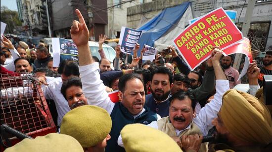 Police stop Congress’ J&K chief Vikar Rasool Wani and other senior party leaders during a protest over the imposition of property tax, in Jammu on Thursday. (PTI)