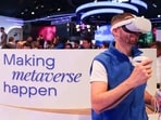 An attendee wears a Meta Platforms Inc. Oculus Quest 2 virtual reality (VR) headset at the Telefonica SA stand on day two of the Mobile World Congress at the Fira de Barcelona venue in Barcelona, Spain.