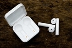 A pair of bluetooth earphones make listening to music or having a conversation easy and crystal clear.