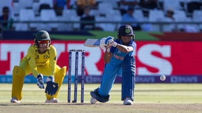 India's Harmanpreet Kaur makes a shot while Australia's Alyssa Healy looks on during the Women's T20 World Cup semi final cricket match in Cape Town. (AP) India's Harmanpreet Kaur makes a shot while Australia's Alyssa Healy looks on during the Women's T20 World Cup semi final cricket match in Cape Town. (AP)