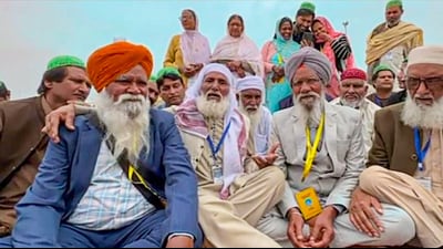 Reunion of the families of Sikh brothers -- Gurdev Singh and Daya Singh (who were separated during the partition) -- at Kartarpur Corridor. Daya Singh in light grey suit. (PTI Photo) Reunion of the families of Sikh brothers -- Gurdev Singh and Daya Singh (who were separated during the partition) -- at Kartarpur Corridor. Daya Singh in light grey suit. (PTI Photo)