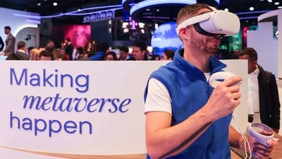 An attendee wears a Meta Platforms Inc. Oculus Quest 2 virtual reality (VR) headset at the Telefonica SA stand on day two of the Mobile World Congress at the Fira de Barcelona venue in Barcelona, Spain. (Bloomberg) An attendee wears a Meta Platforms Inc. Oculus Quest 2 virtual reality (VR) headset at the Telefonica SA stand on day two of the Mobile World Congress at the Fira de Barcelona venue in Barcelona, Spain. (Bloomberg)