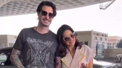 Actor Sunny Leone and her husband Daniel Weber were seen together at the Mumbai airport. The couple posed for the paparazzi after which they entrered the airport building holding hands. For the travel, Sunny wore a pastel coloured dress and heels while Daniel opted for a charcoal T-shirt, matching pants and sneakers. 