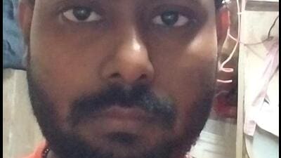 Worker crushed to death as part of hydraulic parking system falls