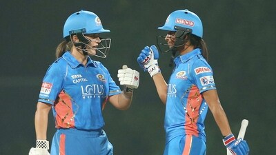 Mumbai, Mar 04 (ANI): Mumbai Indians skipper Harmanpreet Kaur and Amelia Kerr during the inaugural Women's Premier League (WPL) match against Gujarat Giants, at Dr DY Patil Sports Academy, in Mumbai on Saturday. (ANI Photo) (Women's Premier League (WPL) Twi) Mumbai, Mar 04 (ANI): Mumbai Indians skipper Harmanpreet Kaur and Amelia Kerr during the inaugural Women's Premier League (WPL) match against Gujarat Giants, at Dr DY Patil Sports Academy, in Mumbai on Saturday. (ANI Photo) (Women's Premier League (WPL) Twi)