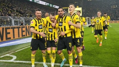 Dortmund's team players celebrate after Marco Reus scored a penalty, the opening goal, during the German Bundesliga soccer match (AP) Dortmund's team players celebrate after Marco Reus scored a penalty, the opening goal, during the German Bundesliga soccer match (AP)