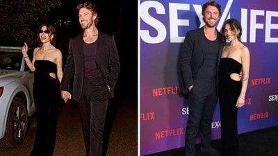 Adam Demos with Sarah Shahi. Adam Demos with Sarah Shahi.