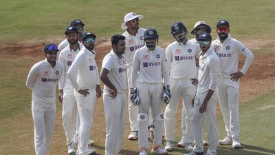 Indian players wait for the third umpire's decision for the wicket of Australia's Usman Khawaja during the third day of third cricket test (AP) Indian players wait for the third umpire's decision for the wicket of Australia's Usman Khawaja during the third day of third cricket test (AP)