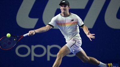 USA's Tommy Paul returns the ball against USA's Taylor Fritz during semifinals the Mexico ATP Open 500 men's singles tennis match at the Arena GNP, in Acapulco, Mexico, on March 3, 2023. (Photo by RODRIGO ARANGUA / AFP) (AFP)