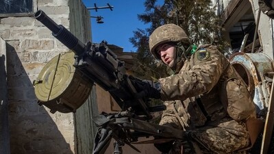 A Ukrainian serviceman fires an automatic grenade launcher, as Russia's attack on Ukraine continues, in the front line city of Bakhmut, in Donetsk region, Ukraine on Friday. (REUTERS)