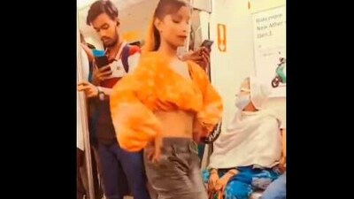 The image, taken from a Twitter video, shows a woman dancing inside Delhi Metro. (Twitter/@MajDPSingh)