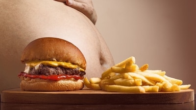 Obesity can occur because of lack of physical activities, excess diet, low cost easy available foods, high-density foods, high snack consumption, less exercise. (Representational Image) (Pixabay )