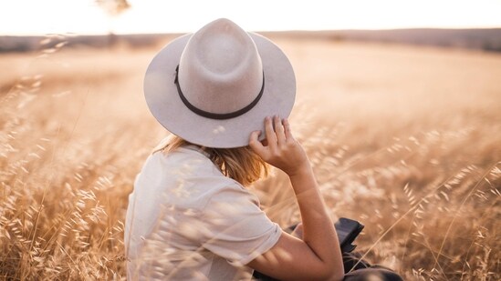 Wide-brimmed Hat: A wide-brimmed hat is not only a practical accessory for sun protection, but it also adds a touch of glamour to any outfit.(pexels )