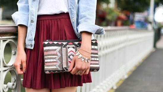 Clutch Purse: A clutch purse is a small, handheld bag that adds a touch of elegance and sophistication to any outfit.(Unsplash)