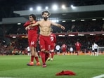 Mohamed Salah celebrates scoring Liverpool's sixth goal with Trent Alexander-Arnold