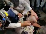 Screengrab of the video showing Congress leader Koustav Bagchi getting his head shaved off.