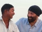 Sunny Deol poses with the man.