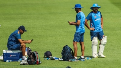 India's head coach Rahul Dravid, left ,captain Rohit Sharma, right and batting coach Vikram Rathour attend a practice session (AP)