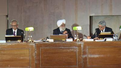 Retired judges participating in the staged hearing on stubble-burning at the Open Hand monument in Chandigarh. (Keshav Singh/HT )