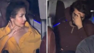 Arjun Kapoor covers his face as he arrives with girlfriend Malaika Arora. Arjun Kapoor covers his face as he arrives with girlfriend Malaika Arora.