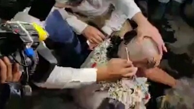 Screengrab of the video showing Congress leader Koustav Bagchi getting his head shaved off. (Youtube/HT Bangla)