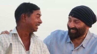 Sunny Deol poses with the man.