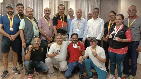The winners posing with their medals at the Inter-Media Table Tennis Championship in Chandigarh. (HT Photo)