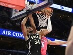 Milwaukee Bucks forward Giannis Antetokounmpo (34) dunks past Washington Wizards forward Anthony Gill (16). Milwaukee Bucks forward Giannis Antetokounmpo (34) dunks past Washington Wizards forward Anthony Gill (16).
