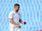 FILE PHOTO: South Africa's Anrich Nortje looks at the ball before bowling in the first cricket test match vs West Indies, March 1, 2023.  REUTERS/Siphiwe Sibeko/File Photo