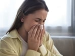 A few common signs of a dust allergy include sneezing, runny nose, teary eyes, coughing, and breathing difficulties. 