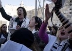 Members of Women of the Wall sing during Rosh Hodesh prayers in the Old City of Jerusalem. The group has waged a decades-long campaign for gender equality at the holy site. (AP) Members of Women of the Wall sing during Rosh Hodesh prayers in the Old City of Jerusalem. The group has waged a decades-long campaign for gender equality at the holy site. (AP)