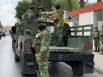 Mexican army soldiers prepare a search mission for four U.S. citizens kidnapped by gunmen in Matamoros, Monday. (AP)