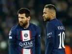 Paris St Germain's Lionel Messi and Neymar ahead of a free kick