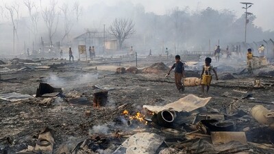 Rohingya refugee boys seen salvaging a gas cylinder after the fire. At least 35 mosques and 21 learning centres for the refugees were also destroyed, though there were no reports of any injuries or deaths, officials added.&nbsp; (Mahmud Hossain Opu / AP)