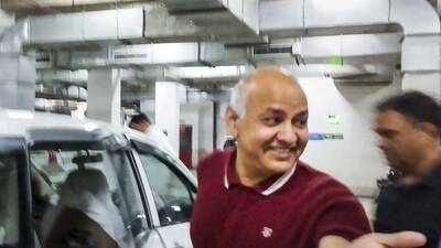 AAP leader Manish Sisodia after being produced in the Rouse Avenue Court in New Delhi on Saturday. (PTI) AAP leader Manish Sisodia after being produced in the Rouse Avenue Court in New Delhi on Saturday. (PTI)