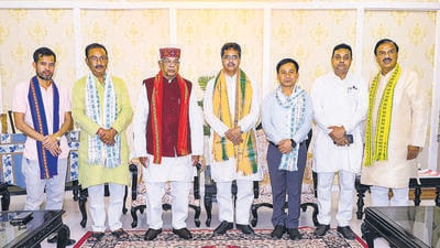 BJP leader Manik Saha (centre) with Tripura governor Satyadeo Narain Arya (third from left) and other BJP leaders at Raj Bhavan, in Agartala on Monday. (PTI) BJP leader Manik Saha (centre) with Tripura governor Satyadeo Narain Arya (third from left) and other BJP leaders at Raj Bhavan, in Agartala on Monday. (PTI)
